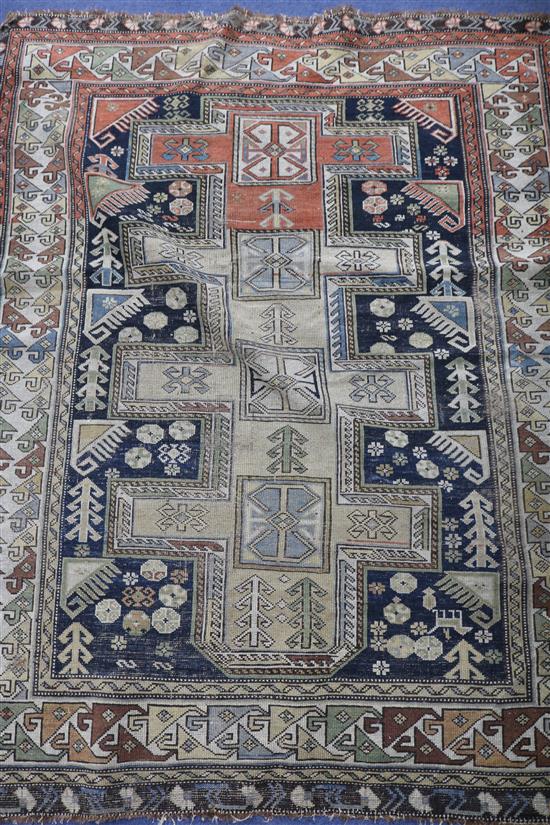 A Caucasian blue ground rug, 140 x 117cm